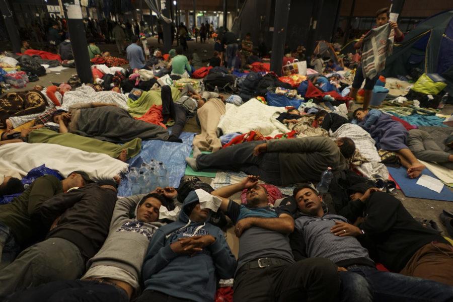 Syrian refugees rest on the floor of Keleti railway station.