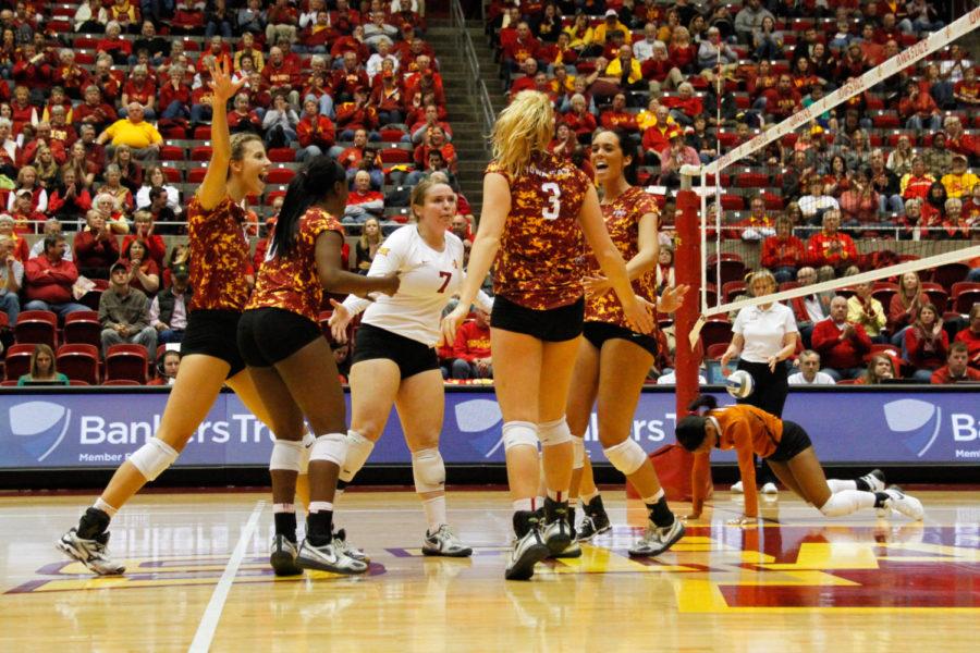 The Cyclones celebrate during a match against the Texas Longhorns in a game in Hilton Coliseum on Saturday. The Cyclones would go on to lose 3-0. 