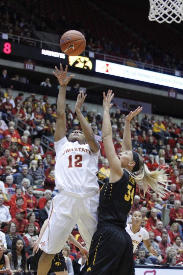 Seanna+Johnson%2C+junior+guard%2C+shoots+the+basketball+at+the+CyHawk+game+on+Dec.+11+at+Hilton+Coliseum.+Johnson+has+started+every+game+of+her+career.