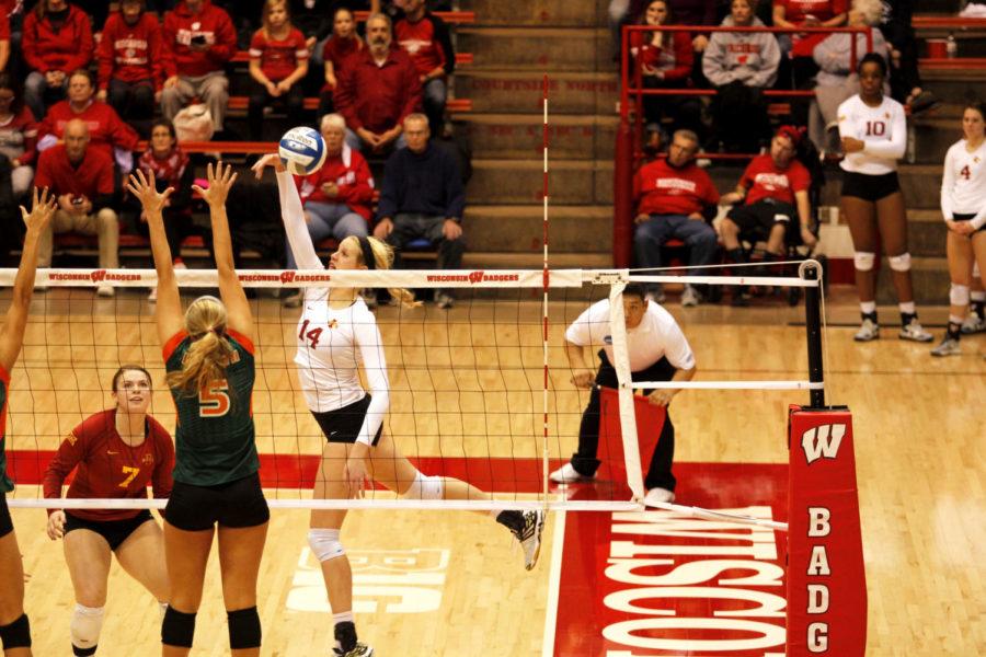 Freshman outside hitter Jess Schaben tips the ball around the Miami (FL) blockers. Iowa State defeated Miami in the first round of the NCAA Tournament with scores of 25-21, 26-24 and 25-20. Schaben had a .389 hitting percentage in the match with 16 kills on Thursday. 