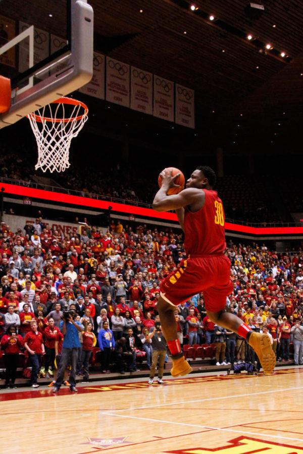 Redshirt junior guard Deonte Burton goes up for a dunk during Hilton Madness on Friday in the Hilton Coliseum. 
