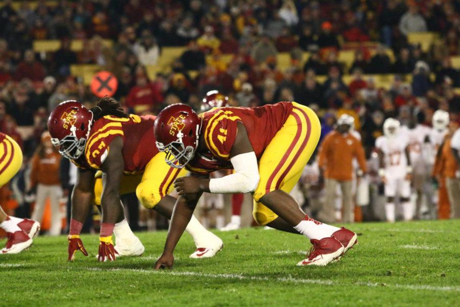 Defensive lineman Demon Tucker (left) and Darius White (right) wait for the snap against Texas on Oct. 31.