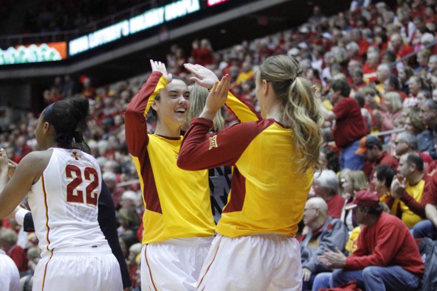 Emily Durr, sophomore guard, celebrates with a teammate during the CyHawk game on Dec. 11. ISU won 69-66 at Hilton Coliseum.