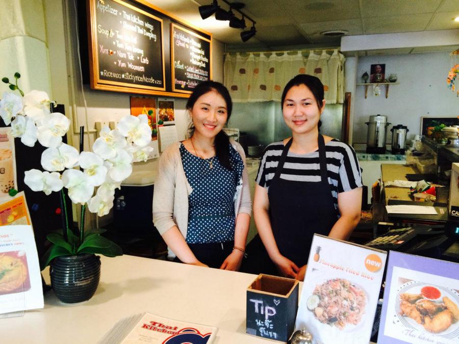 Punwasa Chaothanakit (L), owner of Thai Kitchen, and Supunsa Bastin (R), manager of the restaurant, pose for a photo at the register.