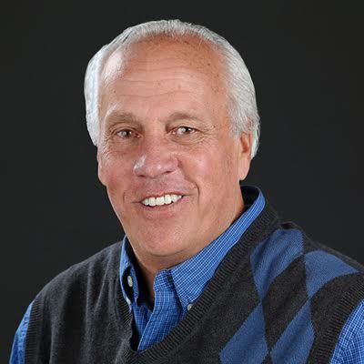 Randy Peterson, sports columnist for The Des Moines Register, suffered a broken leg at the CyHawk game after the crowd stormed the court. 