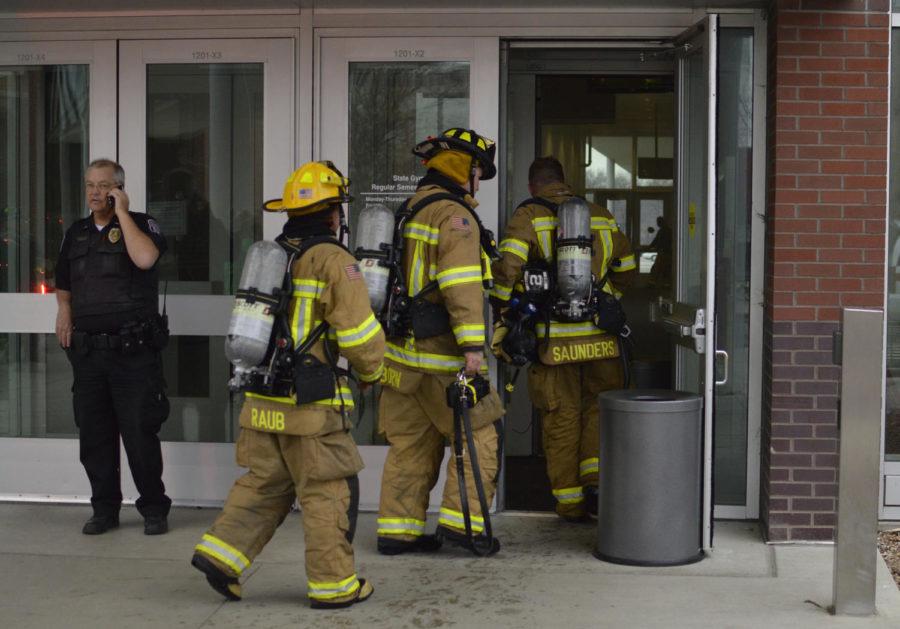 The Ames Fire Department enters State Gym on Sunday in response to a fire.
