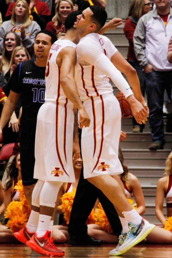 Seniors Nazareth Mitrou-Long, left, and Abdel Nader celebrate after a defensive stop during a basketball game against the Buffalo Bulls on Dec. 7 in Hilton Coliseum. The Cyclones would go on to win 84-63.
