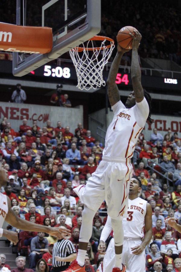 Jameel McKay, redshirt senior forward, prepares to dunk at the basketball game against University of Arkansas-Pine Bluff on Dec. 13.