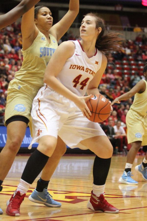 Bryanna Fernstrom, sophomore center, takes the basketball from an opponent of Southern University on Dec. 6 at Hilton Coliseum.