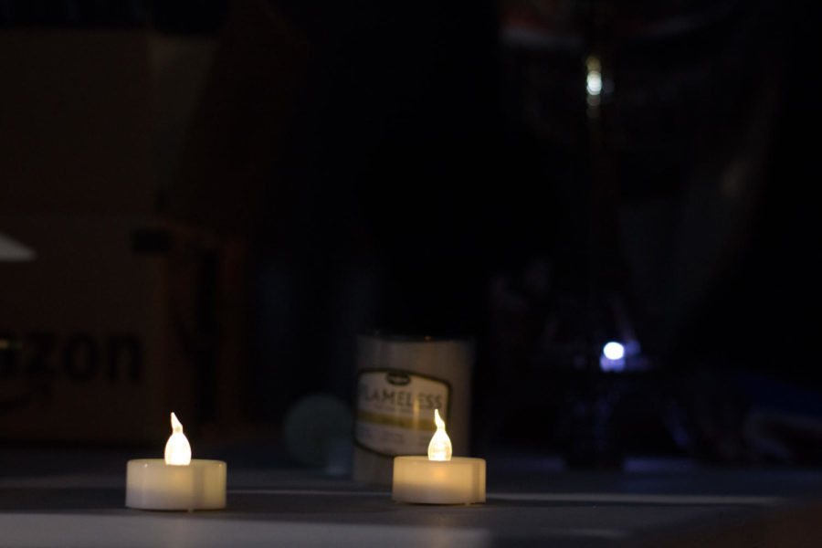 Candles sit on a table outside of Pearson Hall as part of a candlelight vigil Friday night. The vigil was to support all of those suffering in the wake of acts of hate and discrimination around the world, primarily highlighting the attacks in Paris, the Black Lives Matter movement and the refugee crisis. 