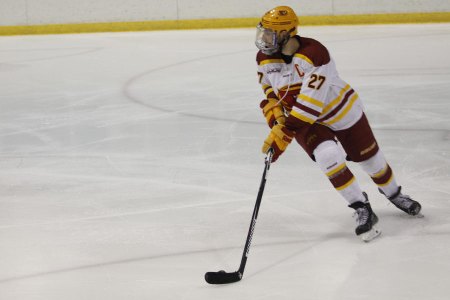 Senior forward Alex Stephens controls the puck at the ISU vs Augustana game Oct. 30. The ending score was 11-0.