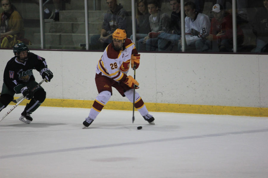 Freshman defense Jake Arroyo takes control of the puck against the Ohio Bobcats on Saturday, Oct. 10.