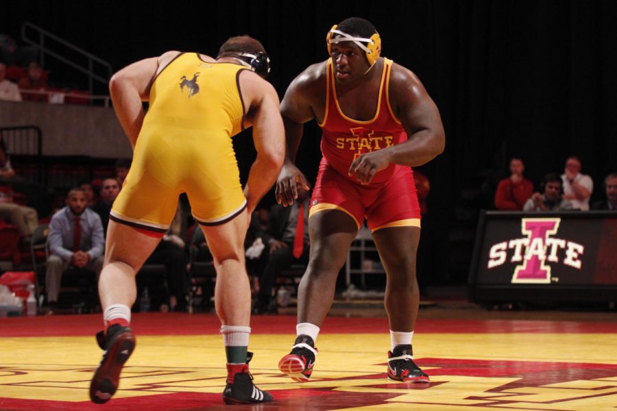 Quean Smith, redshirt junior, wrestles an opponent from University of Wyoming in the 285-pound category on Dec. 12.