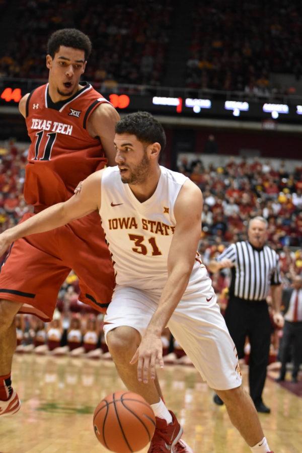 Georges Niang, senior forward, dribbles past Zach Smith, an opponent from Texas Tech on Jan. 6 at Hilton Coliseum. ISU won 76-69.