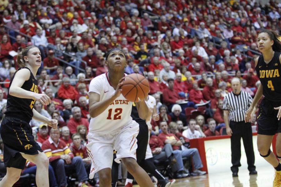 Seanna Johnson, junior guard, prepares to shoot the basketball during the CyHawk game on Dec. 11. Johnson scored 22 points, reaching her fifth career of a 20-point game.