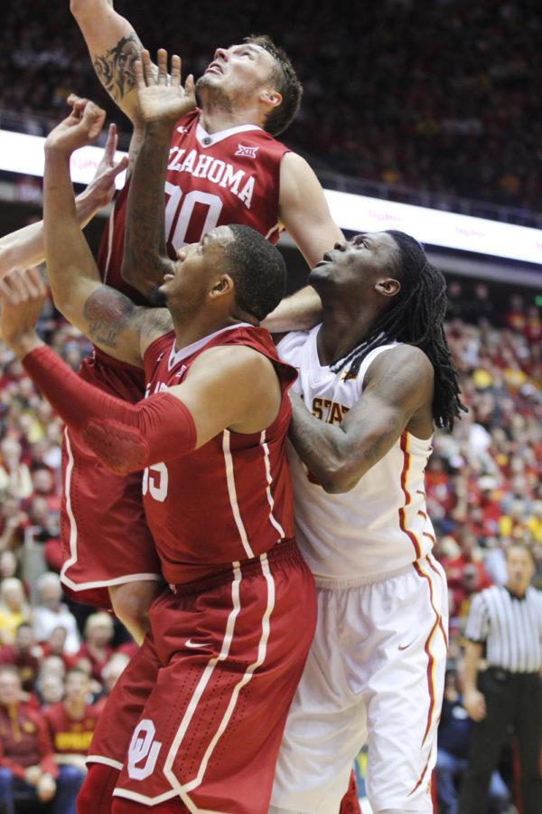 Redshirt junior guard Jameel McKay tangles with some Oklahoma players during the game against No. 15 Oklahoma at Hilton Coliseum on March 2. The No. 17 Cyclones defeated the Sooners 77-70 after a rocky 18-point first half.