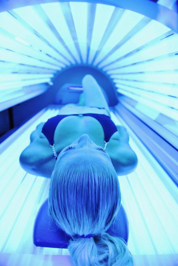 Using+tanning+beds+with+UV+rays%2C+like+the+one+shown+above%2C+can+be+damaging+to+the+skin.