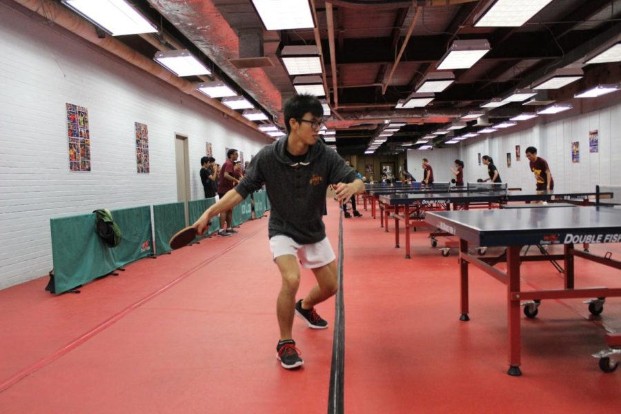 A member of the ISU table tennis club competes at a tournament. 