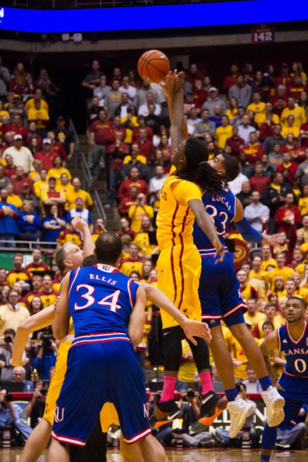Senior Jameel McKay jumps for the tip-off during a game against the Kansas University Jayhawks on Jan 25. The Cyclones would go on to win 85-72.  