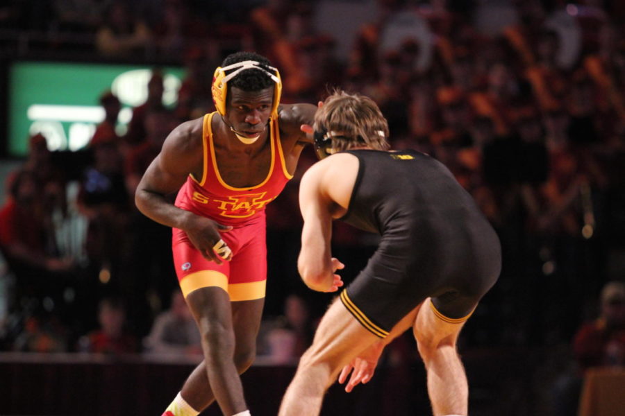 Earl Hall, senior, faces an opponent from University of Iowa at the Iowa Corn Cy-Hawk Series match on Nov. 29 at Hilton Coliseum.