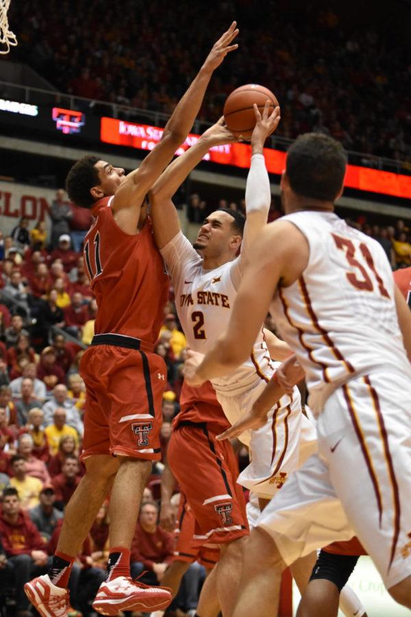 Abdel+Nader%2C+redshirt+senior+forward%2C+fights+to+shoot+the+basketball+against+Zach+Smith%2C+an+opponent+from+Texas+Tech+on+Jan.+6.+The+Cyclones+beat+the+Raider+Reds+76-69.