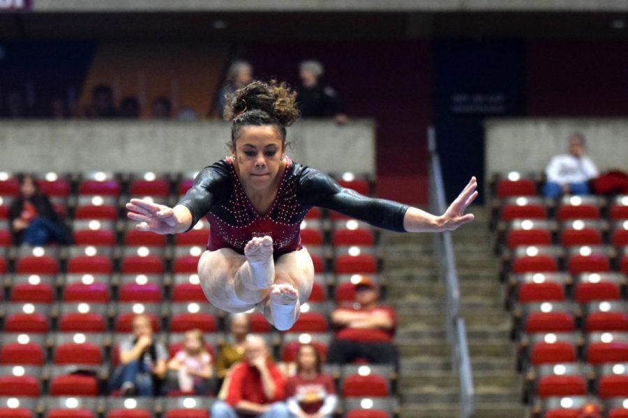Freshman Haylee Young does a pike jump on the beam at the NCAA Regionals on Saturday at Hilton Coliseum.