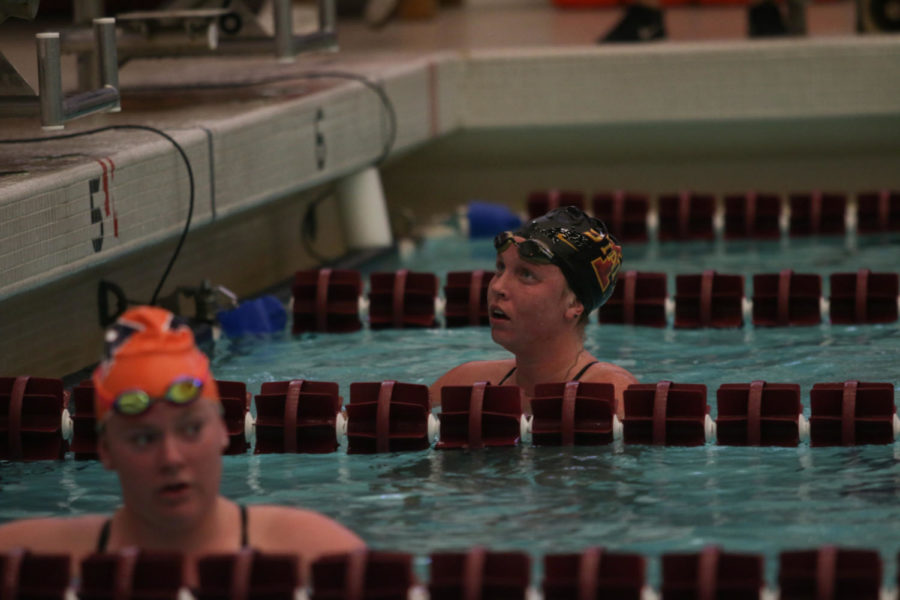 Senior Mollie McNeel looks at the clock after finishing the 1000 free. Ruegemer swam the event in 10:45.43.