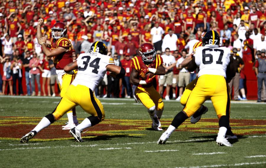 Running back Tyler Brown runs through a gap against University of Iowas defense Saturday during the first quarter at Jack Trice Stadium. The Cyclones lost to the Hawkeyes 31-17.