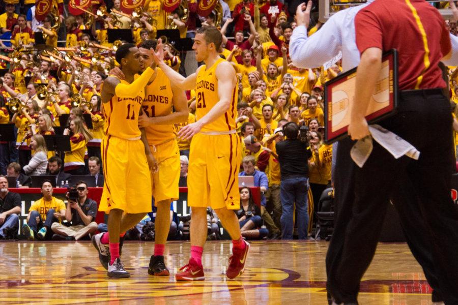 Junior Matt Thomas and senior Georges Niang congratulate junior Monte Morris after a big play during a game against the Kansas University Jayhawks on Jan. 25, 2016. The Cyclones went on to win 85-72.  