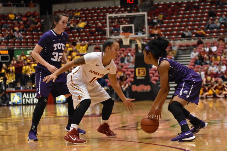 Nicole Kidd Blaskowsky, senior guard, blocks an opponent and prepares to steal the ball from TCU during the basketball game on Jan. 27.