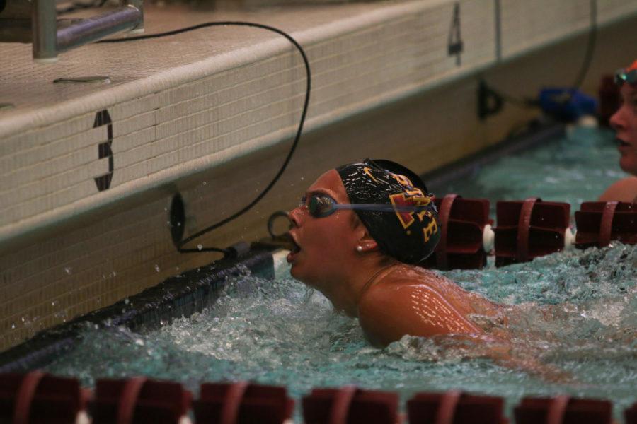 Haley Ruegemer, freshman, looks at the clock after finishing the 1000 free against University of Illinois on Friday night. Ruegemer swam the event in 10:37.98