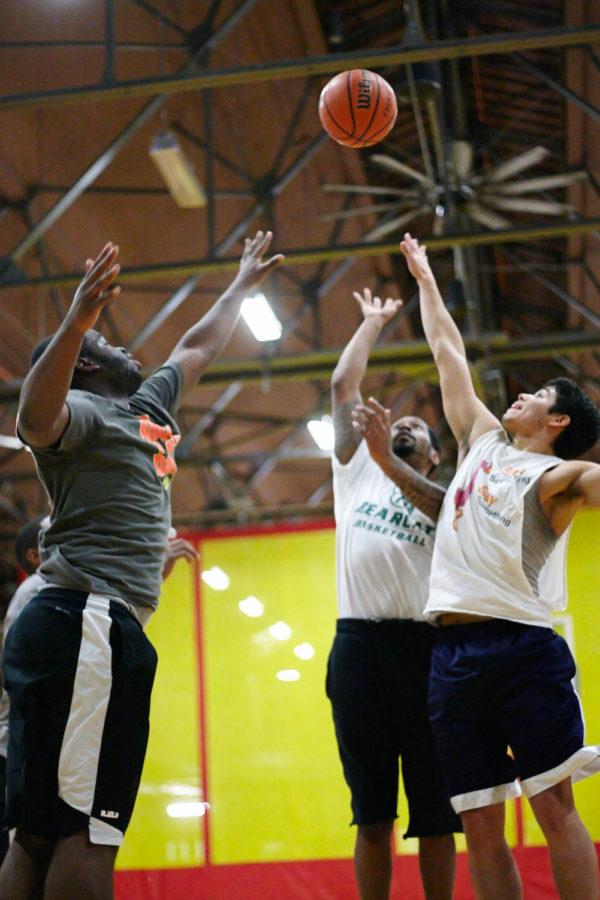 Dazhawn Davis, Johnny Castro, and Cameron Woods all go up for the rebound during an ISU Basketball scrimmage on Nov. 19, 2014. Participating in a club activity that doubles as exercise can help alleviate stress and improve health.