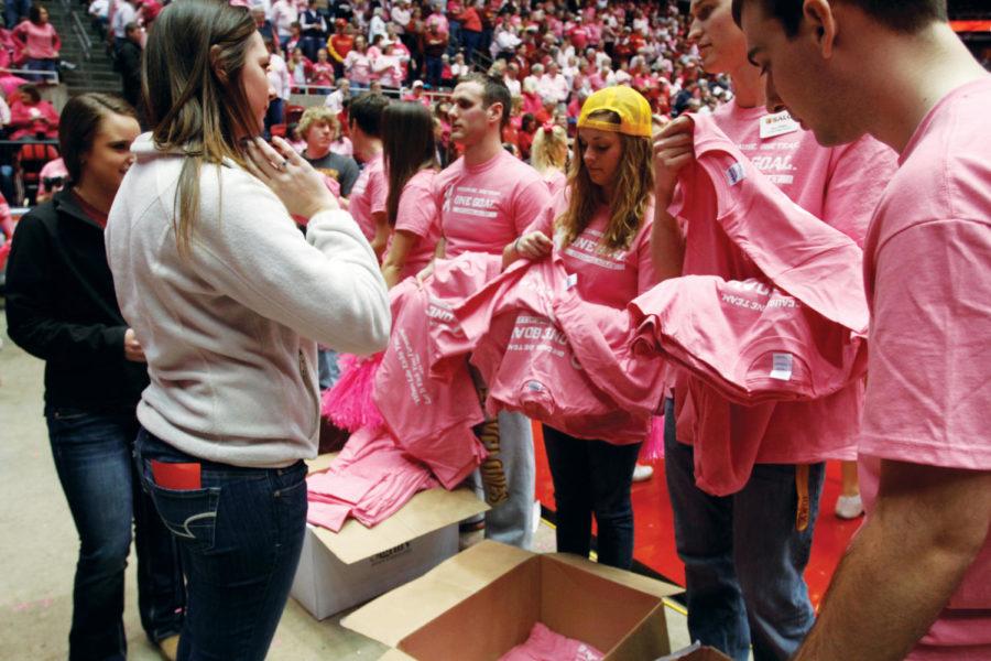 Members+of+Cyclone+Alley+line+up+to+receive+pink+T-shirts+and%0Apom-poms+prior+to+the+ISU+womens+basketball+game+against%0AOklahoma%C2%A0on+Saturday%2C+Feb.+18%2C%C2%A0at+Hilton+Coliseum.+The+game+was+a%0Apart+of+WBCAs+Play+4+Kay+pink+initiative+and+sought+to+raise%0Abreast+cancer+awareness+among+Cyclone+fans.%0A