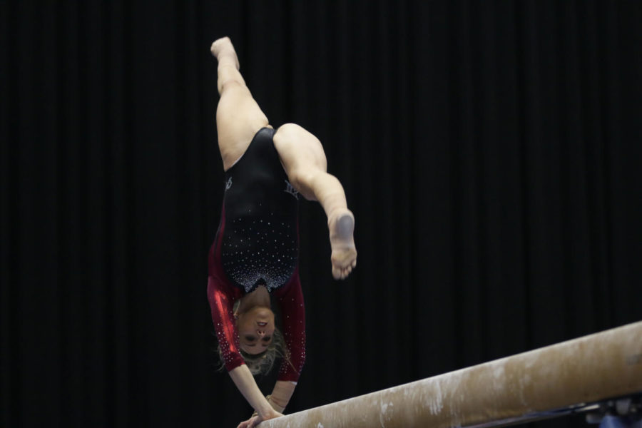 Alex Marasco, senior, performs her balance beam routine during the meet against Lindenwood and North Carolina State Jan. 23. Marasco would go on to earn a 9.875 for the event. 