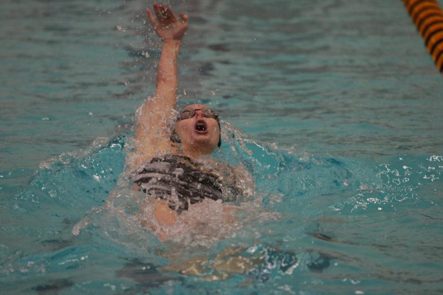 Senior Marissa Engel swims the 100 yard backstroke during the meet against the University of Illinois on Friday night. Engel finished first in the event with a time of 57.97.