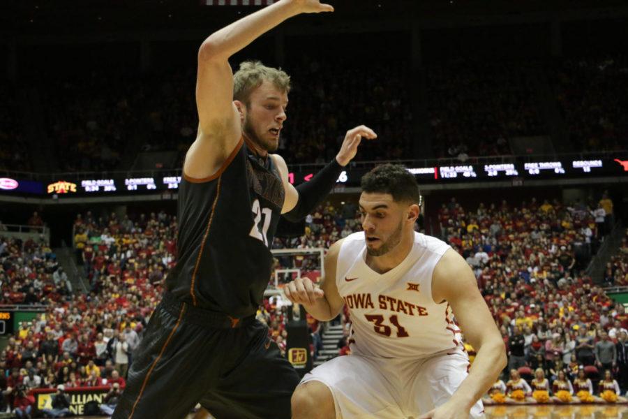 Georges Niang maneuvers around a player during the game against Texas Feb. 13. 
