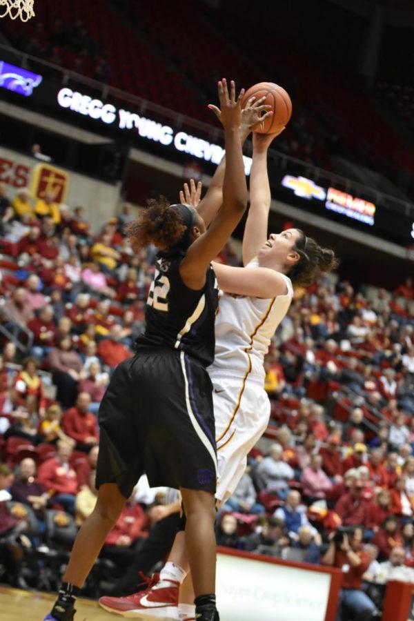 Maddie Baier shoots the ball over Kansas States Breanna Lewis on Wednesday at Hilton Coliseum. 