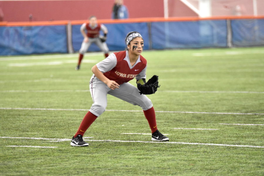 Senior infield Brittany Gomez prepares to catch the softball at the IUPUI game at Bergstrom Football Complex on Feb. 12.