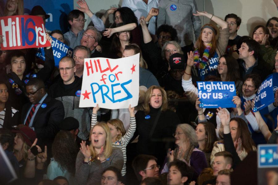 Hillary Clinton supporters raise signs in the air before her speech at the Olmsted Center at Drake University on Feb. 1. At the time of her speech, Clinton was nearly tied with Bernie Sanders. 