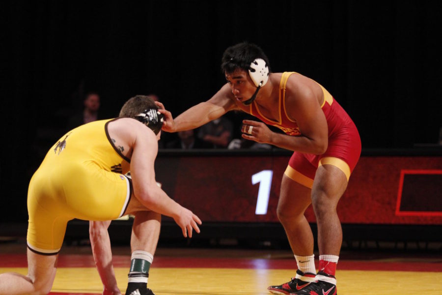 Dane Pestano, redshirt sophomore, pushes an opponent from the University of Wyoming on Dec. 12. The Cyclones beat the Cowboys 19-14.