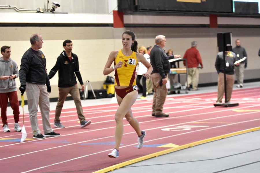 Freshman Kelly Naumann runs in the womens 5000-meter during the Iowa State Classic on Feb. 12.