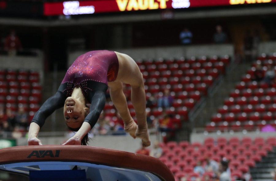 Sophomore Briana Ledesma performs her vault routine during the meet against West Virginia on Feb. 5. Ledesma scored a 9.65. 