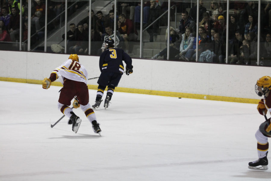 Junior forward Alex Grupe goes after the puck against Central Oklahoma. He scored a goal during the first period of the game. The final score was a loss for the cyclones of 2 to 4. 