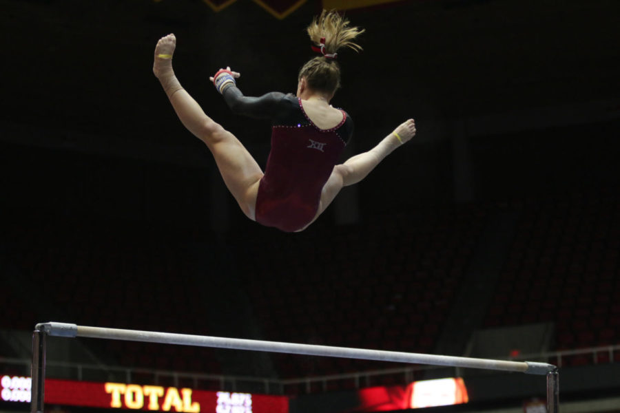 Sophomore Kelsey Paz performs her uneven bars routine during the meet against West Virginia on Feb 5. Paz scored 9.75, contributing to the Cyclones narrow 195.3-195.2 win over the Mountaineers. 