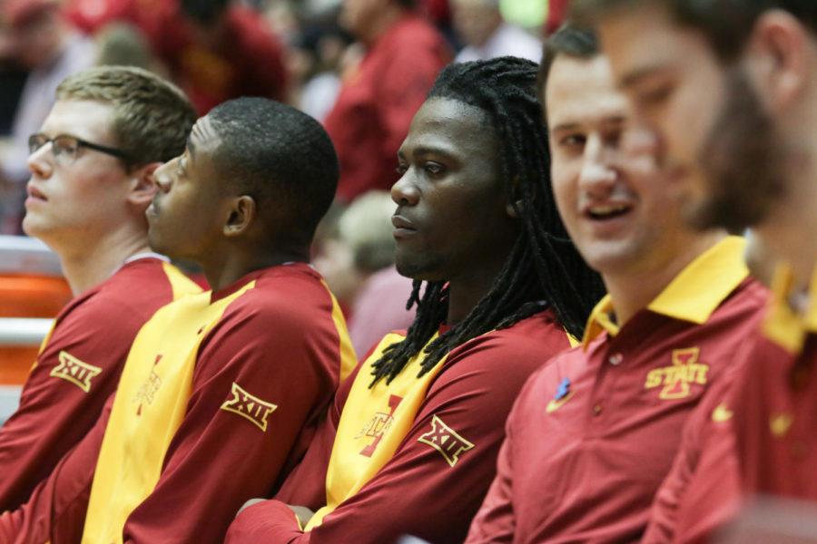 Redshirt senior Jameel McKay watches his teammates face TCU on Feb. 20. McKay was sidelined the whole game. 