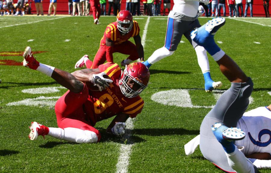 Iowa State wide receiver DVario Montgomery is brought down by Kansas safety Fish Smithson at the 20 yard line. The Cyclones would go on to beat the Jayhawks 38-13. 