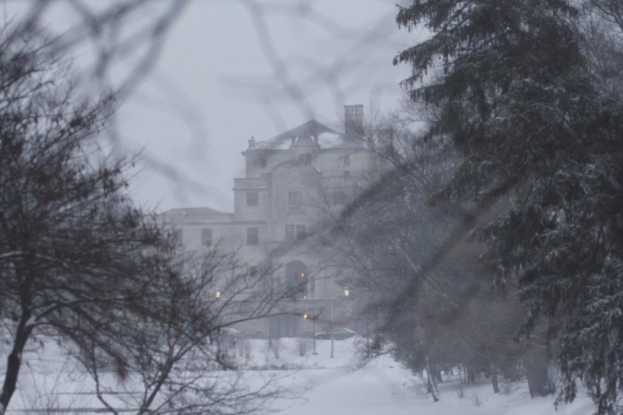 The Memorial Union stands in a haze as the weather worsens at Iowa State University Monday evening, creating treacherous road and walking conditions throughout campus.