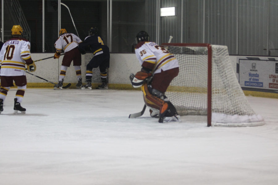 Junior defense Eero Helanto, freshman forward Aaron Azevedo and sophomore goalie Matt Goedeke defend the puck at the game against Central Oklahoma. Azevedo would score a power play goal in the first period.