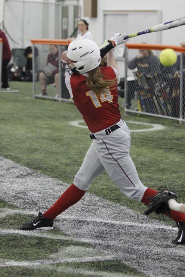 Sophomore outfielder Kelsey McFarland hits a foul ball back into the netting during the 7-0 win against IUPUI on Feb. 12. McFarland went a perfect 3 for 3 with two RBIs and one run. 