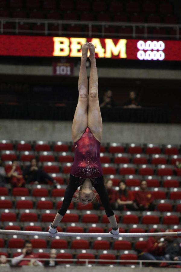 Senior Sara Townsend performs her uneven bars routine during the meet against West Virginia. Townsend scored a 9.625. 